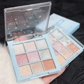 Close-up of a 9-color eyeshadow palette with shimmer, matte, and glitter textures in rose pink - Snowflake 9 Colors Light Blue Tones
