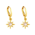 Golden huggie hoop earrings featuring zircon star charms in a minimalist jewelry style - White