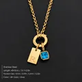 Elegante collar de acero inoxidable chapado en oro de 14K con inicial R y circón azul - Letra R