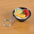 Japanese ramen keychain with miniature egg, shrimp, and green onions on wood background - Squid and Egg Noodles with Keychain / 5cm x 2cm x 2.5cm