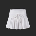 Detailed view of white pleated tennis skirt showing drawstring waist and knit fabric texture - S / White