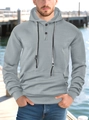 Detail van grijze herenhoodie met geometrische reliëftextuur en hals met knoop en trekkoord - S / Grijs