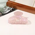 Close-up of pink pearlescent PVC hair claw clip with glossy shell texture finish - PVC 8cm Square Head - Iridescent Pink