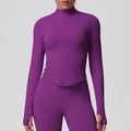 Detail of purple ribbed yoga jacket featuring stand collar, zipper, and thumbholes - Plum Purple
