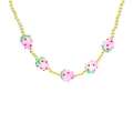Detailed close-up of a gold bead necklace featuring five cute pink strawberry charms - B2-Pink Strawberry Necklace