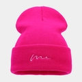 Detail of rose red knitted beanie with white 'me' embroidery on the ribbed cuff - M (56-58cm) / Rose Red