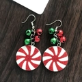 Detail of Christmas peppermint swirl disc earrings with red and green metal bells - Christmas Candy Disk with Bell
