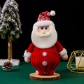 Knitted Santa Claus doll figurine with snowflake decor on a rustic wooden base - Red and White Santa