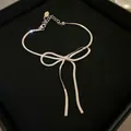 Collana minimalista a catena snake con fiocco d'argento, nappine e chiusura regolabile - Collana in argento piccola