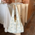 Detail of canvas tote bag featuring blue butterfly prints and rustic raw fringe edges - Vest Style Cyan