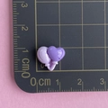 Macro shot of 1cm dual-tone purple resin heart accessory on a measuring grid scale - Purple Heart Balloon