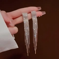Close-up of sparkling long tassel earrings with shimmering crystals held in hand - Rectangular Pave Tassel (E0033) 925 Sterling Silver Earring Post