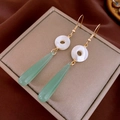 Detail of long drop earrings with gold hooks, shell rings, and green teardrop pendants - Gold Shell Green Teardrop Tassel Style (15#)