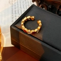 Close-up of golden vintage open ring with red enamel and white zircon heart details - Red Heart Zirconia Opening Ring / Gold-Red Heart
