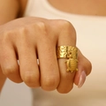 Detail view of a gold turtle charm ring with textured adjustable band on a model - Turtle Style (S536)
