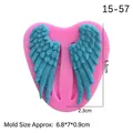 Pink heart-shaped silicone mold featuring a blue angel wing fondant tool for baking - Pink