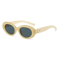 Macro shot of oval cream sunglasses featuring metallic star accents on the temple - Glossy Jelly Yellow Frame Black Grey Lens