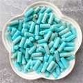 Blue cloud-patterned acrylic cylinder beads for DIY jewelry making in a ceramic bowl - 8x20mm / Turquoise Blue