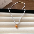 Long irregular pearl necklace with an orange persimmon fruit pendant and golden clasp - Orange Tangerine Pearl (101#)