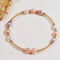 Handmade freshwater pearl bracelet with multicolor beads and gold wire coils on white background - Single Circle Rice Pearl Bracelet