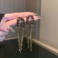 Detailed close-up of dark style tassel earrings with black beads and gold chains - Black Rhinestone Tassel Style 2 (Silver Earring Post)