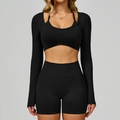 Front view of seamless black three-piece yoga set with long sleeve crop top and shorts - S / Premium Black