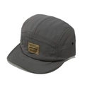 Close-up of the brown brand patch and textured nylon fabric on a 5-panel camper hat - M (56-58cm) / Gray