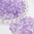 Macro detail of 8mm purple translucent glass beads with a smooth matte silk texture - Gradient Purple