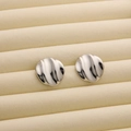 Minimalist silver wavy metal stud earrings with high-shine textured finish in display tray - R190 Wavy Round Style 3 / Steel