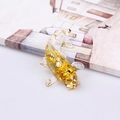 Fish figurine made of clear resin with golden foil flakes for office desktop decor - Citrine