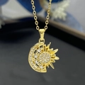 Macro shot of gold-plated sun and moon pendant with sparkling white zircon stones - Gold (8302)