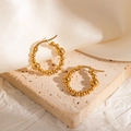 Detailed macro view of 18k gold-plated beaded hoop earrings on elegant marble background - Gradient Beaded Hoop Earrings