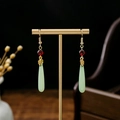 Detail of vintage Chinese earrings with red beads and light green teardrop pendants - Gold Hook Red Bead Green Drop Style (E2023-7)