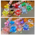 Cute acrylic turtle quicksand keychain with colorful glitter and a matching small bell - Keychain style / Luminous Random Mixed