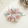 Detail of pink and blue floral tie-dye scrunchie on a ceramic tray with soft shadows - Tie-Dye Pink