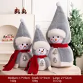 Three plush snowman figurines with grey pointed hats and red scarves for Christmas decor - Gray Cloak Family of Three