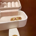 Golden French bow ring with red gemstones presented in a white jewelry box - Vintage Hollow Ring