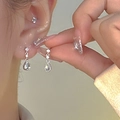 Elegant silver teardrop zircon earrings on model with starburst butterfly detail - Silver Shiny Water Drop Earrings (2005)