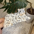 Leopard pattern hair claw clip with gold accents in an animal shaped design - Lying Black and White Spotted Leopard