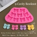 Pink 9-cavity bow silicone mold with measurements showing bow shape and sizes - 9-Hole Bowknot