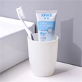 Minimalist white plastic mouthwash cup with toothbrush and antibacterial toothpaste set - Individual OPP Bag / White