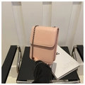 Detail of pink PU leather mini phone bag with gunmetal chain strap and flap closure - Pink