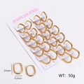 Detailed view of 12 pairs of gold oval stainless steel earrings on a display card - U Shape / Gold