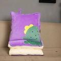 Close-up of a purple cactus pillow unfolding into a beige quilted travel blanket - Purple Cactus / Folded 40x40cm Unfolded 115x145cm