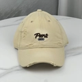 Detailed view of khaki distressed baseball cap featuring Paris 1976 vintage embroidery - One Size (58-60cm) / Beige