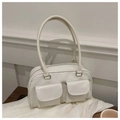 Detail of white PU leather crossbody bag featuring front double flap pockets and top zipper - White