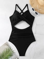 Bañador negro de una pieza con aberturas y tirantes cruzados sobre superficie de piedra - S / Top Y Pantalón / Negro