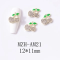 Detail showing 3D alloy cherry nail charms with rhinestones and green enamel leaf detail - Gold Base Large Clear Cherry (AM21)