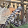Striped fabric headband with blue, white and gray patterns held by hand, sweet hair accessory - Blue-White Stripe Narrow Headband