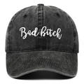 Detailed view of white letter embroidery on washed black denim baseball cap - Black